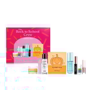 A Macy's \“Back to School Crew\“ beauty set is displayed, featuring a variety of skincare products including a pumpkin-themed mask, serums, sprays, and a lip product.